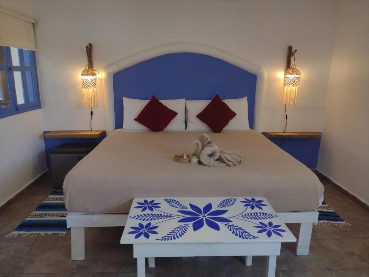 Mio Tulum Hotel Boutique Exteriör bild A bedroom in a hotel in Santorini, Greece